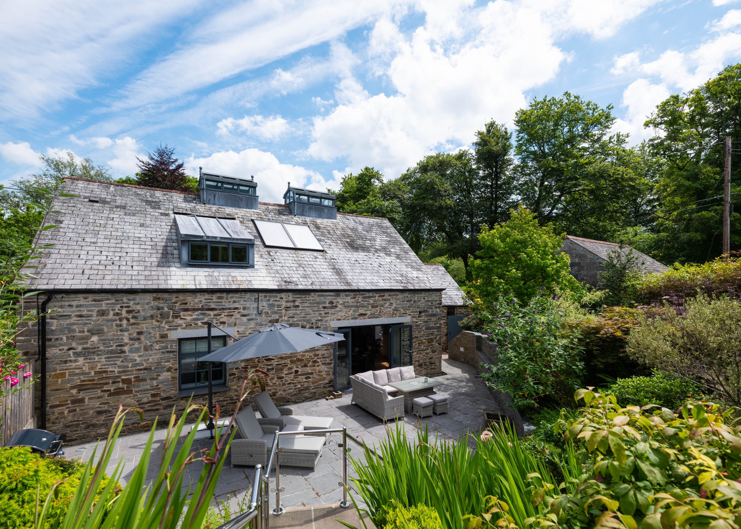 Exterior view of The Forge holiday home with private patio and garden in Bodmin, Cornwall