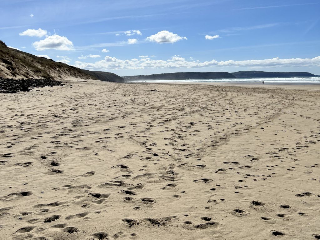 Wide sandy beach at Perranporth, Cornwall with dunes, sea and open coastline
