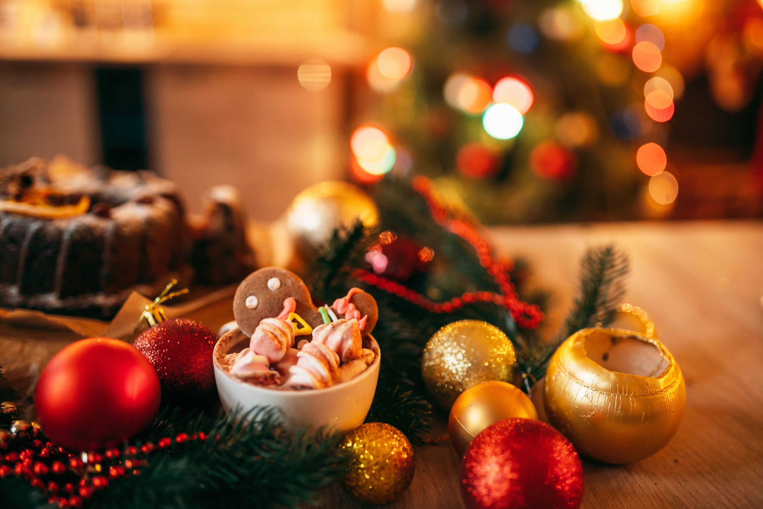Christmas gingerbread dessert with festive decorations and fairy lights