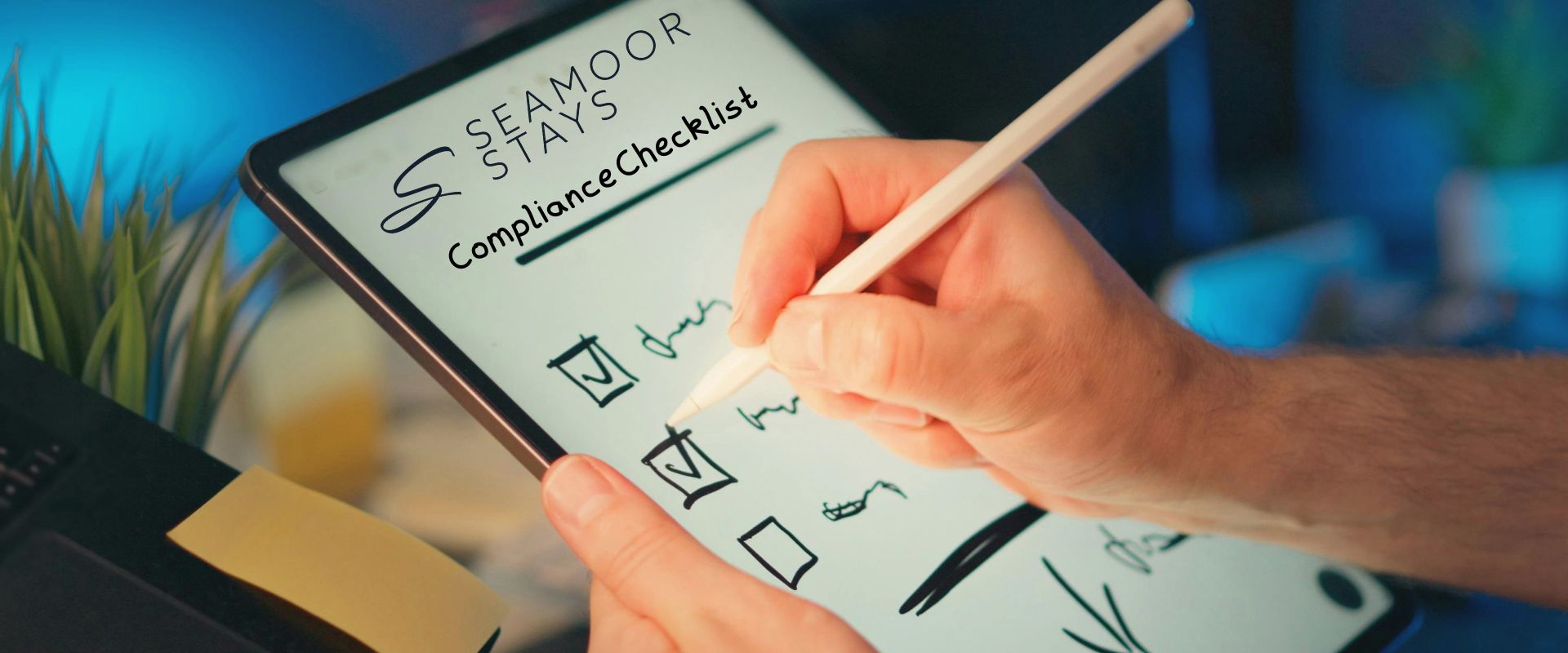 Hand ticking off a holiday let compliance checklist on a tablet